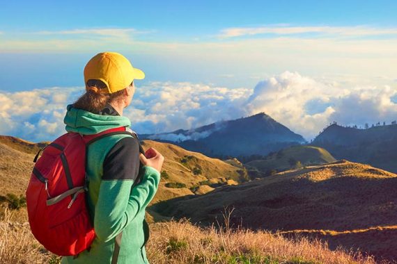 Hiker-portrait-of-young-woman-hiking-in-high-mountains