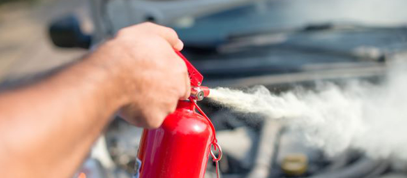 Suitcase with hat, sunglasses and protective medical mask on pastel blue background minimal creative coronavirus covid-19 travel concept.