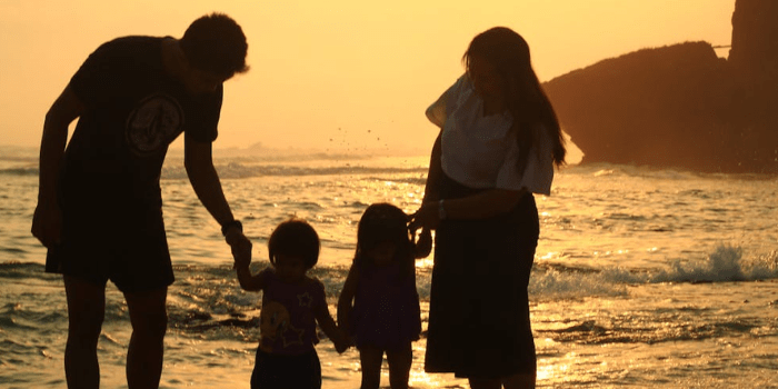 Family at the beach during sunset