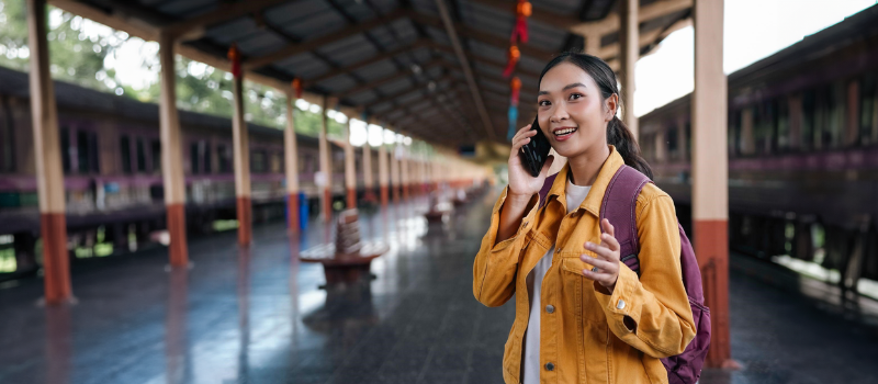 HLAS travel insurance lady at train station